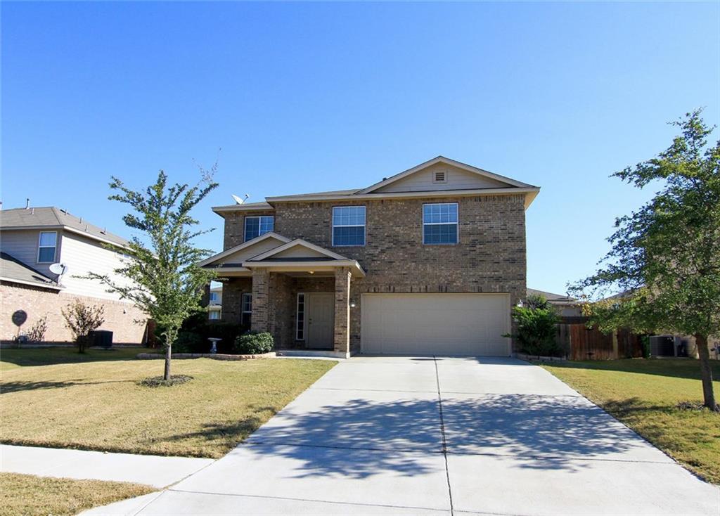 2705 Overton Street Round Rock, TX 78665 - Photo 1 of 19 a front view of a house with a yard