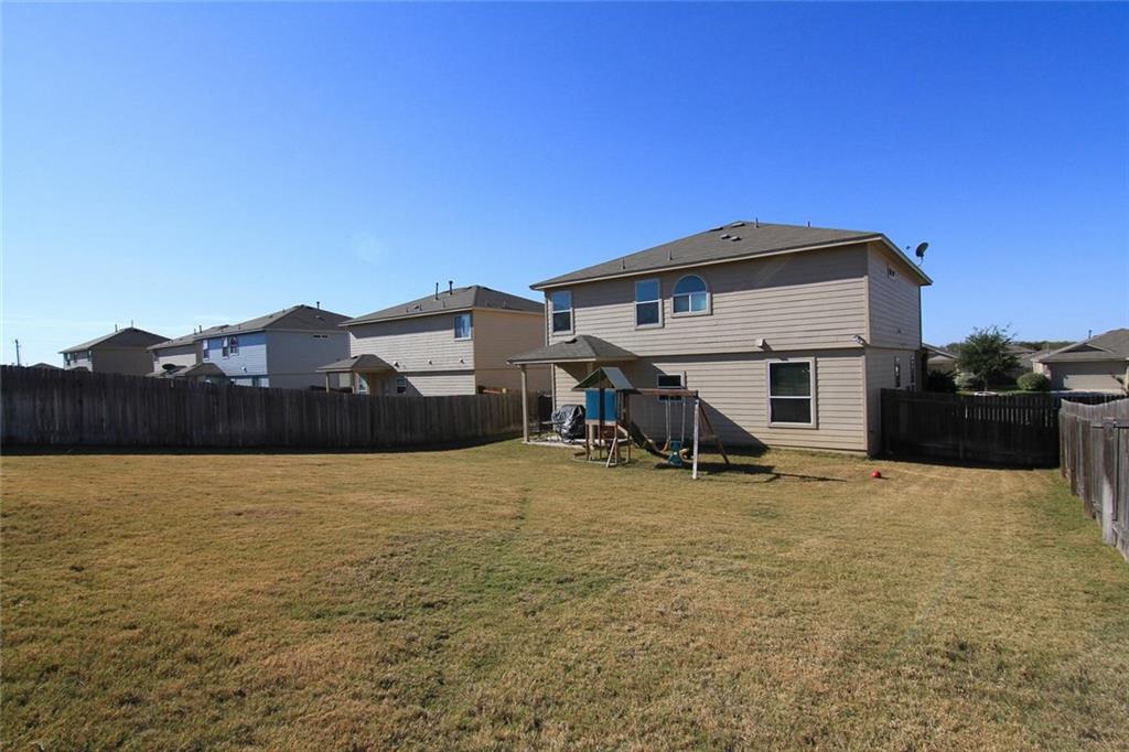 2705 Overton Street Round Rock, TX 78665 - Photo 19 of 19 a view of a house with a yard