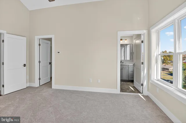 a bathroom with a sink toilet vanity and shower