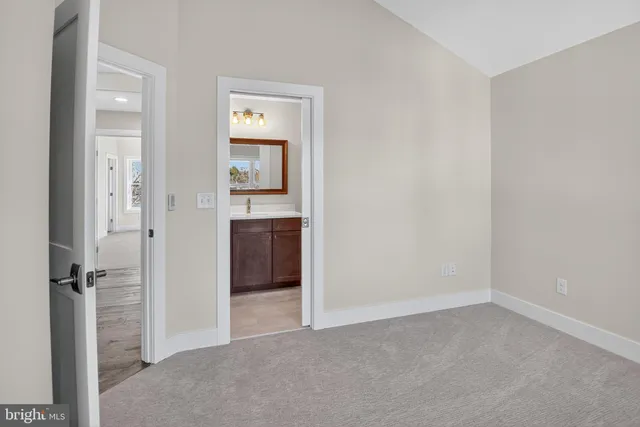 a view of a house with a window and a yard