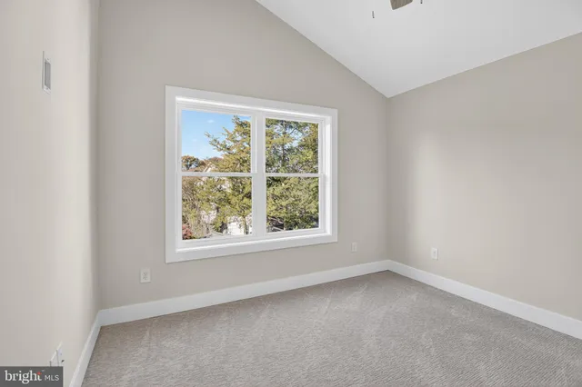 a view of yard with swimming pool and green space