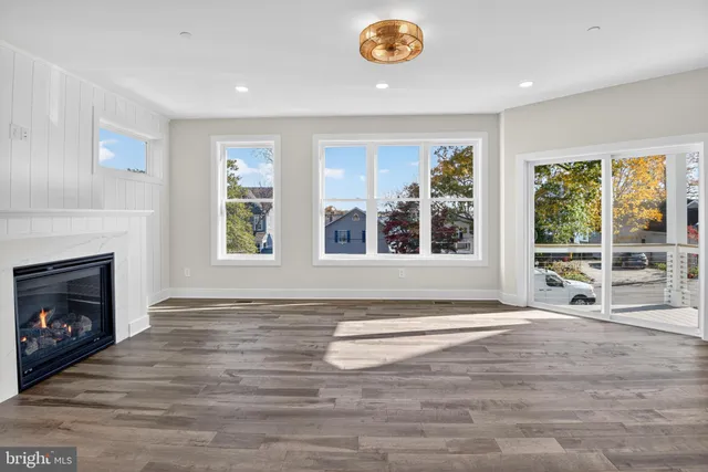 a view of a livingroom with an empty space and a fireplace