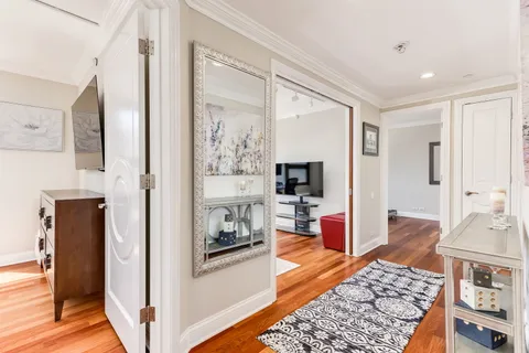 a living room with furniture and a rug