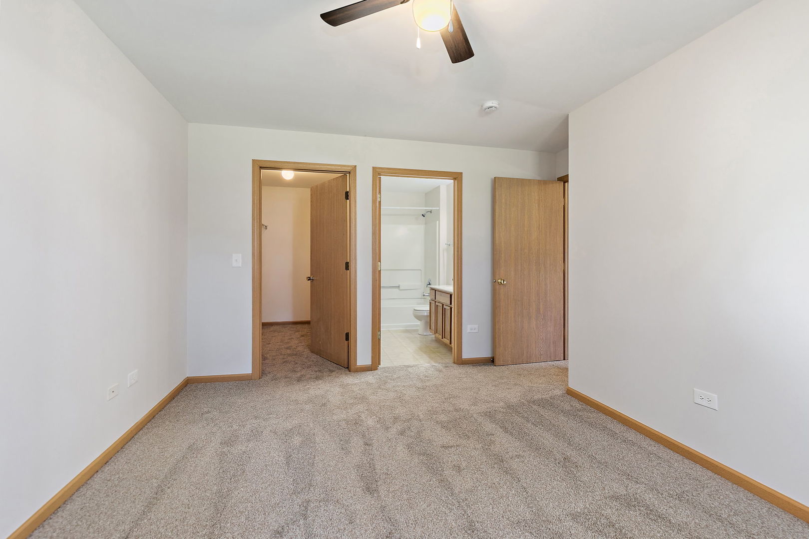 1809 Silverstone Drive, Unit 1809 Carpentersville, IL 60110 - Photo 14 of 17 an empty room with closet and chandelier fan