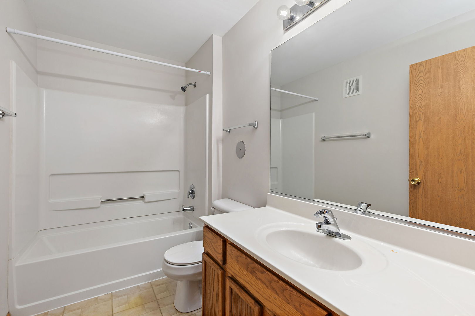 1809 Silverstone Drive, Unit 1809 Carpentersville, IL 60110 - Photo 15 of 17 a bathroom with a sink a toilet and shower