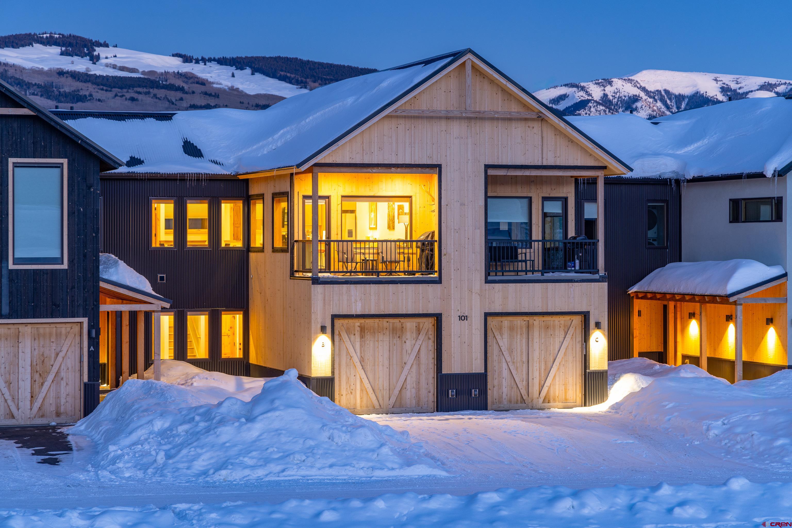 101 Elk Valley Road, Unit B Crested Butte, CO 81224 - Photo 1 of 33 a view of a house with a swimming pool