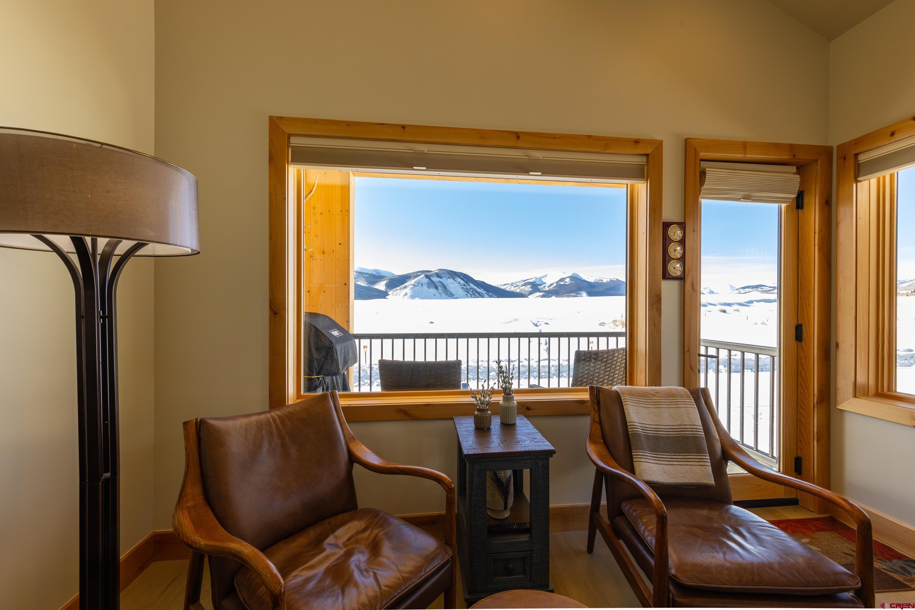 101 Elk Valley Road, Unit B Crested Butte, CO 81224 - Photo 12 of 33 a balcony view with a couch and a table in it