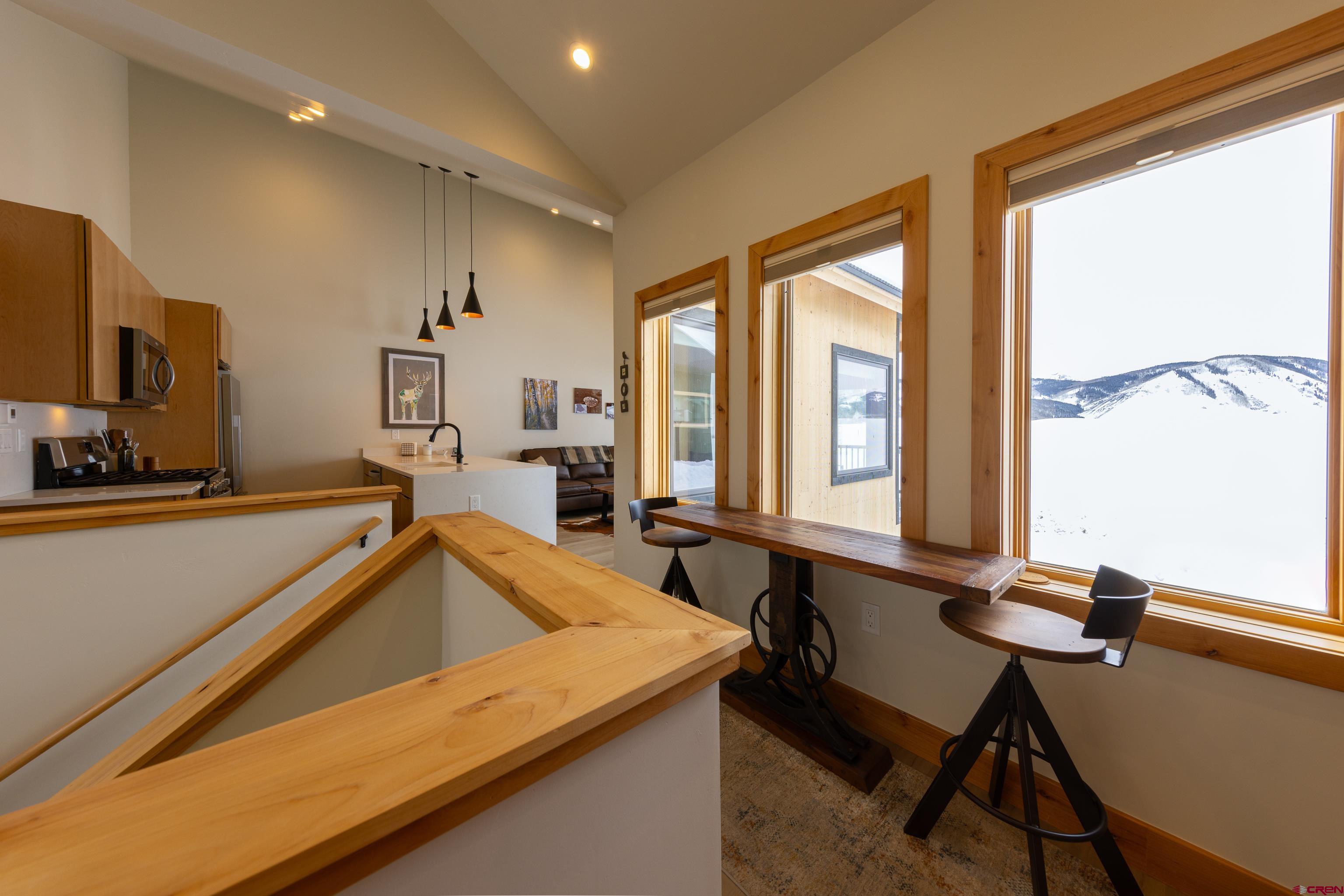 101 Elk Valley Road, Unit B Crested Butte, CO 81224 - Photo 18 of 33 a room with gym equipment and a large window