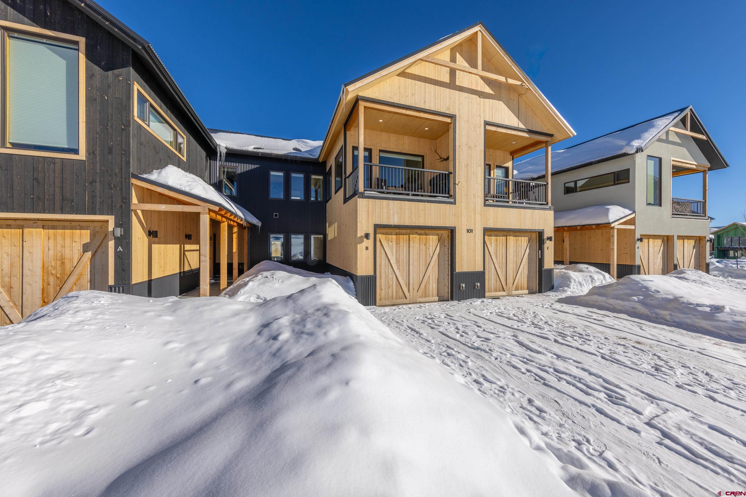 101 Elk Valley Road, Unit B Crested Butte, CO 81224 - Photo 2 of 33 a front view of a house with a yard