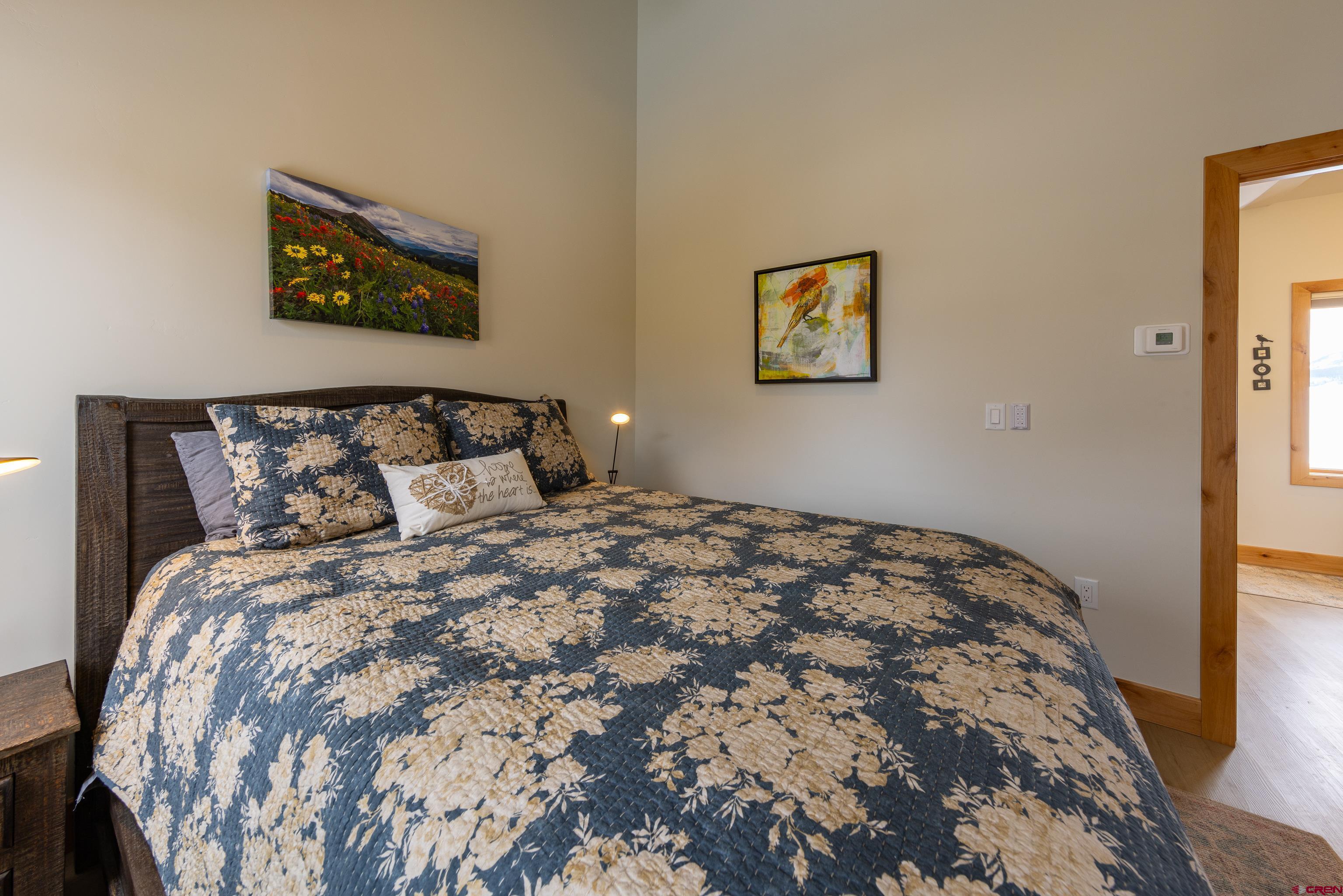 101 Elk Valley Road, Unit B Crested Butte, CO 81224 - Photo 23 of 33 a bedroom with bed and cupboard
