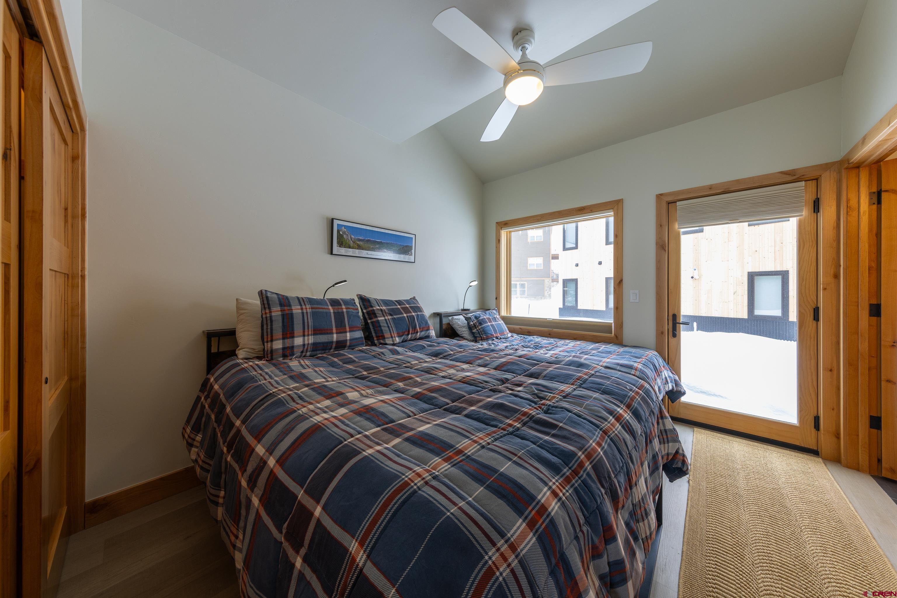 101 Elk Valley Road, Unit B Crested Butte, CO 81224 - Photo 24 of 33 a bed sitting in a bedroom next to a window
