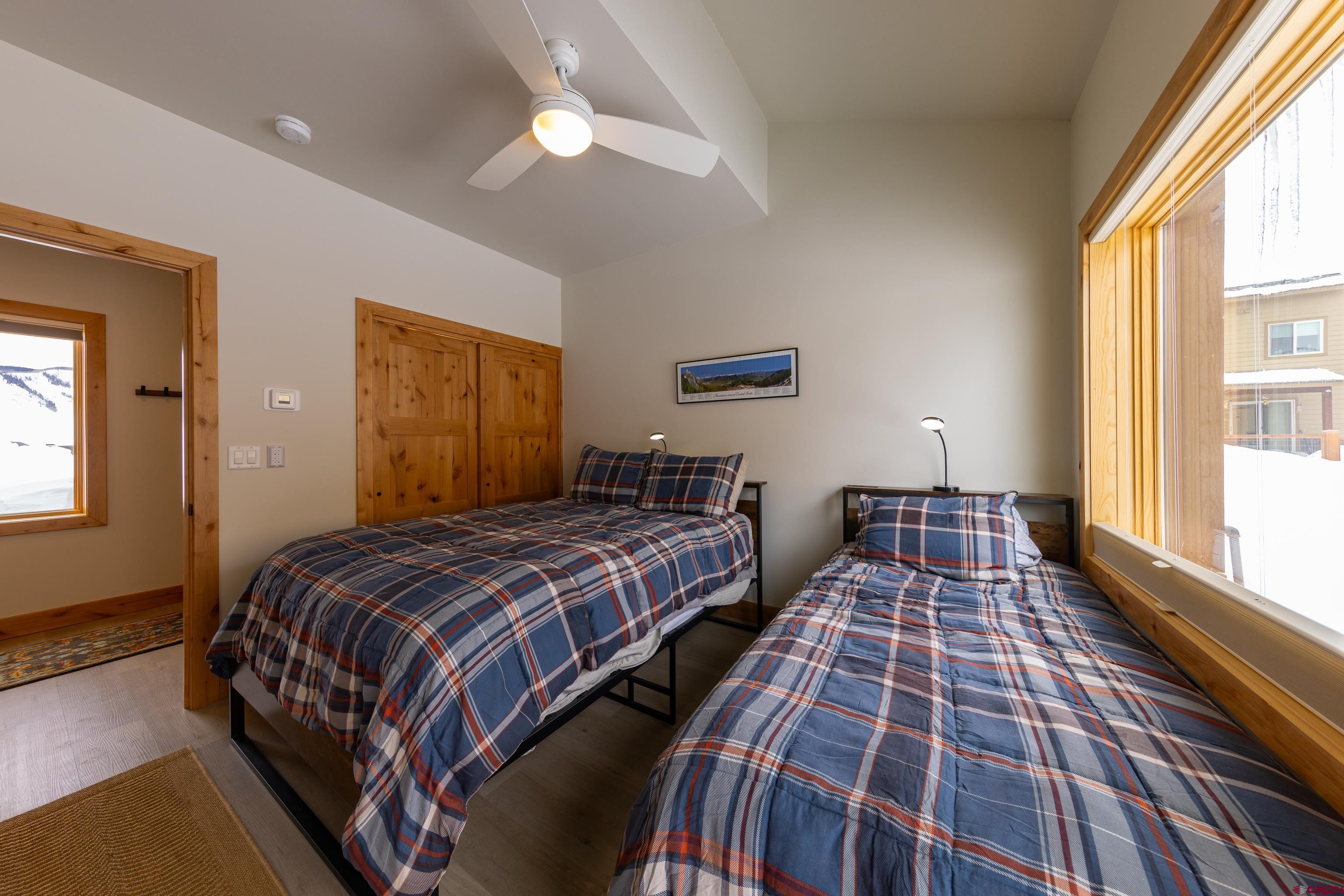 101 Elk Valley Road, Unit B Crested Butte, CO 81224 - Photo 25 of 33 a bedroom with double bed and a window