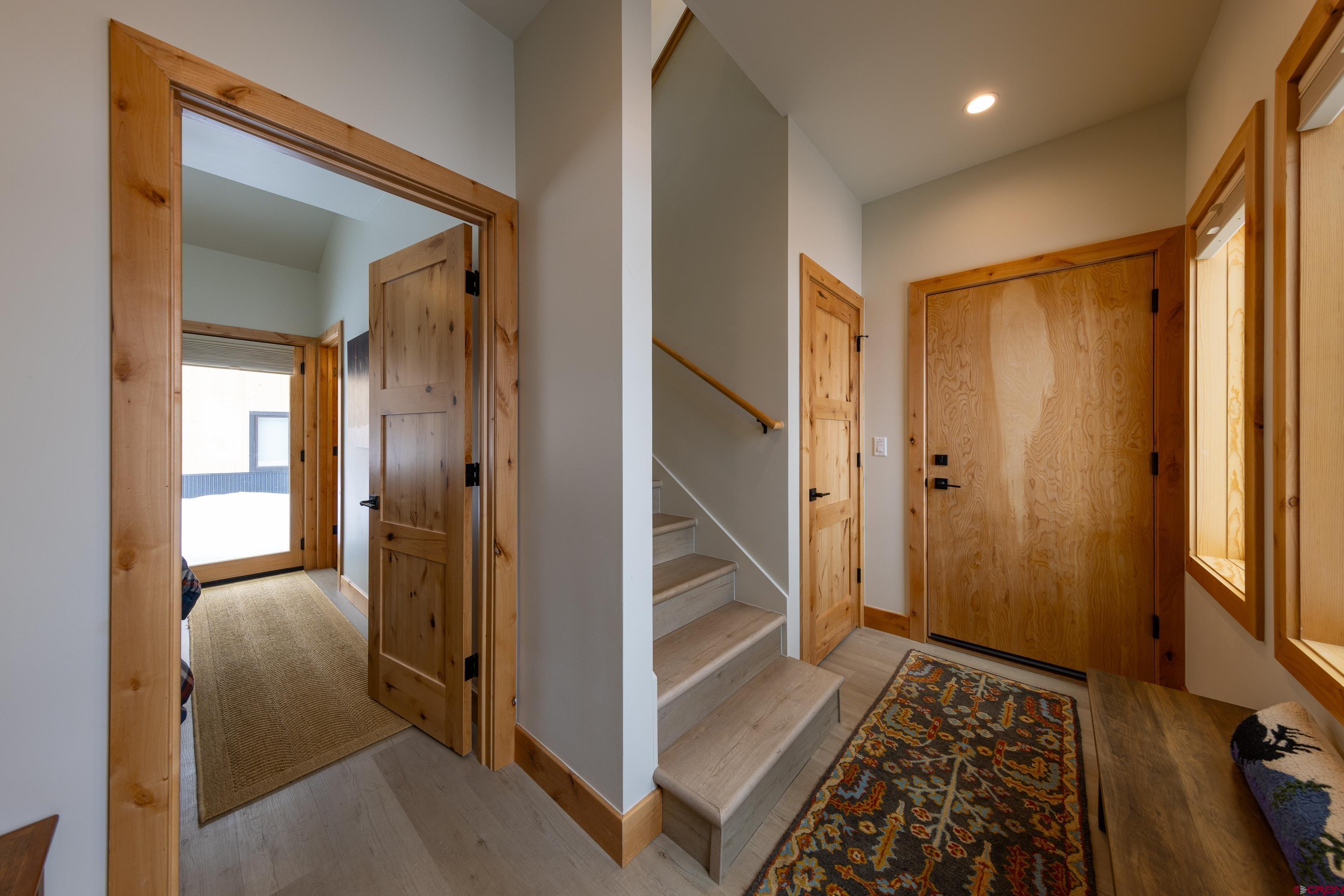 101 Elk Valley Road, Unit B Crested Butte, CO 81224 - Photo 29 of 33 a view of a hallway with wooden floor and staircase