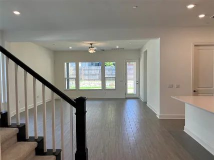 a kitchen with stainless steel appliances a sink stove and refrigerator