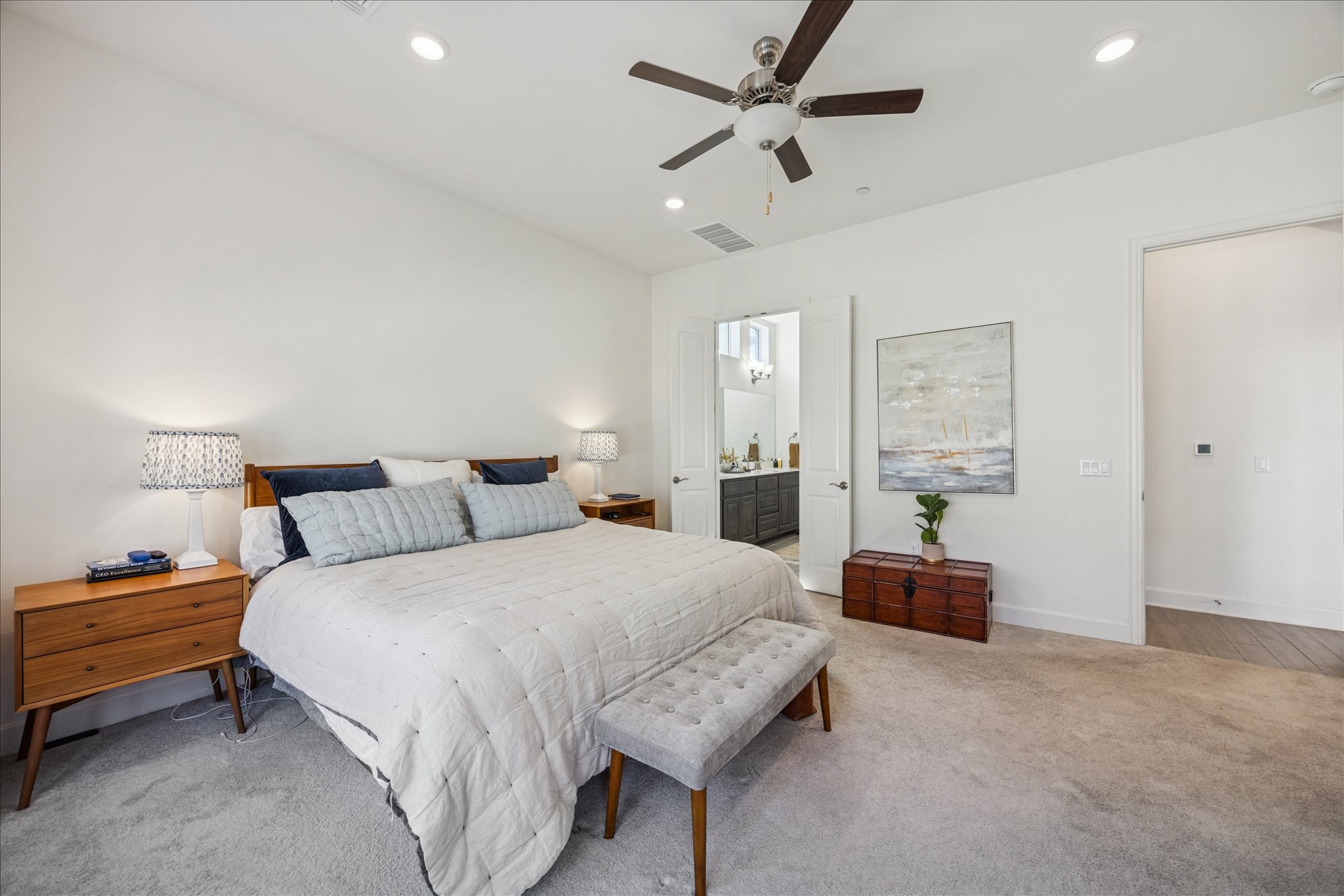 12507 Ayrshire Way, Unit 75 Austin, TX 78732 - Photo 14 of 40 Bedroom with light colored carpet, a ceiling fan, recessed lighting, and connected bathroom
