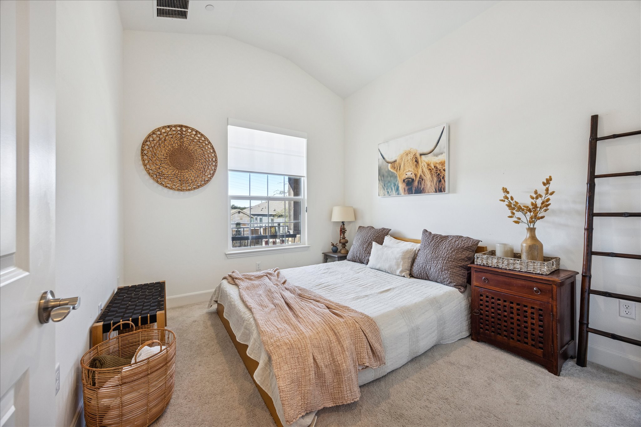 12507 Ayrshire Way, Unit 75 Austin, TX 78732 - Photo 25 of 40 Bedroom featuring light colored carpet and lofted ceiling