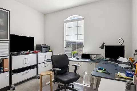 a utility room with stainless steel appliances granite countertop a sink stove and cabinets