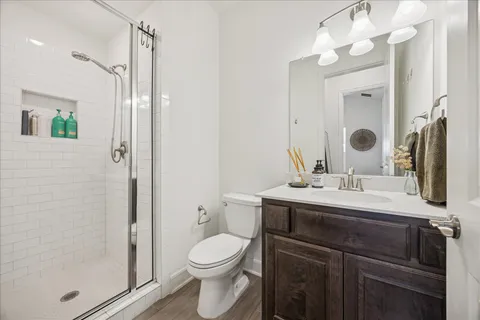 a view of a house with backyard sitting area and garden