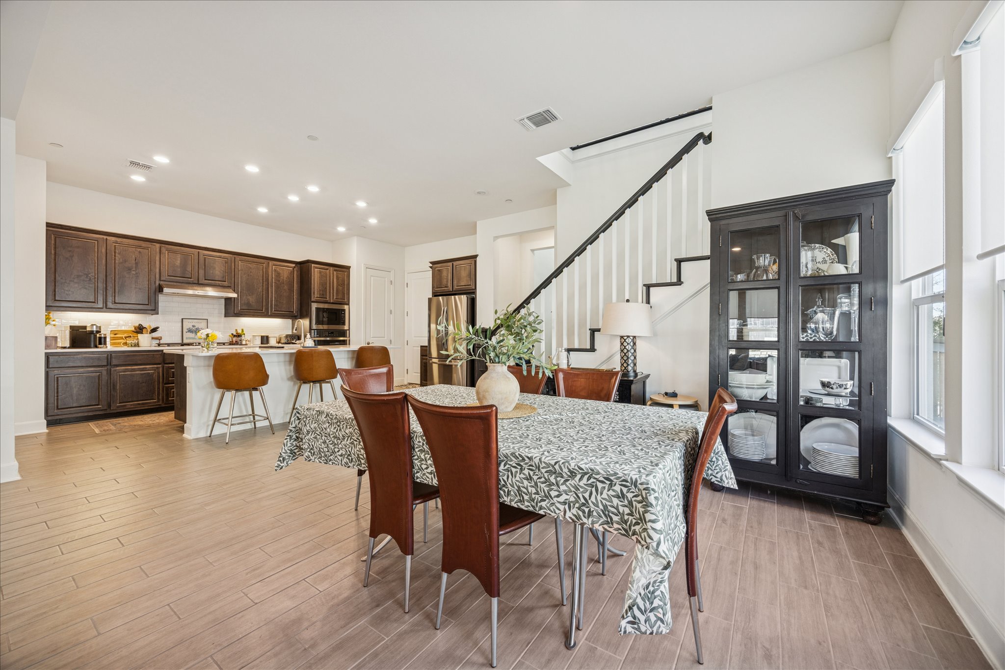 12507 Ayrshire Way, Unit 75 Austin, TX 78732 - Photo 6 of 40 Dining area with wood tiled floors and recessed lighting