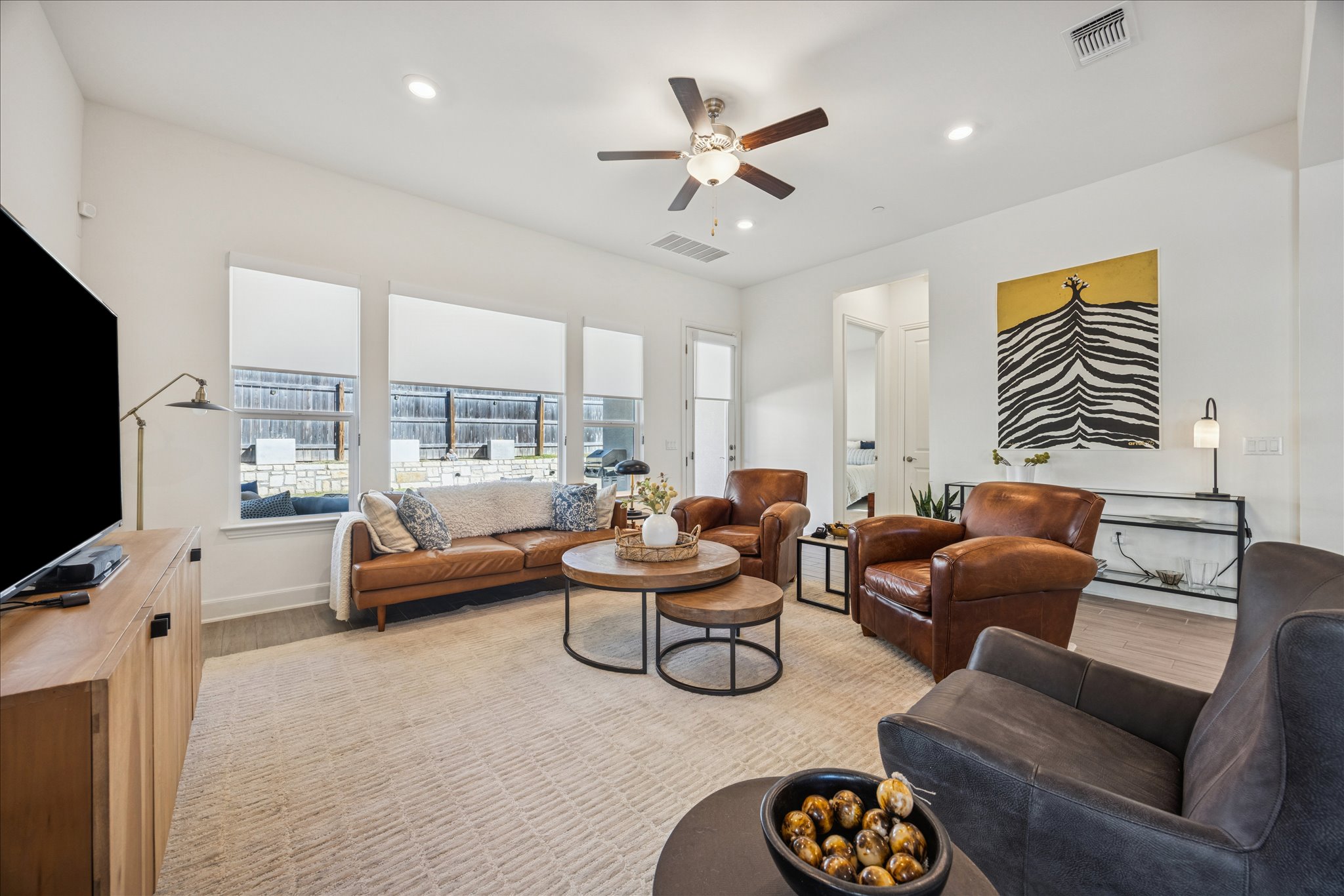 12507 Ayrshire Way, Unit 75 Austin, TX 78732 - Photo 10 of 40 Living area with ceiling fan, light wood-type flooring, and recessed lighting