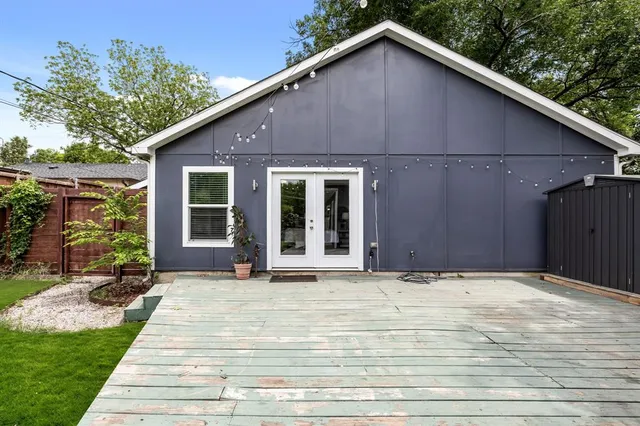 a view of backyard with a deck