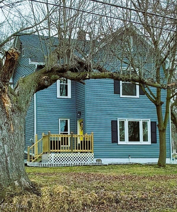 6349 Manchester Road Clinton, OH 44216 - Photo 1 of 23 Back of house featuring a chimney, a yard, and a deck
