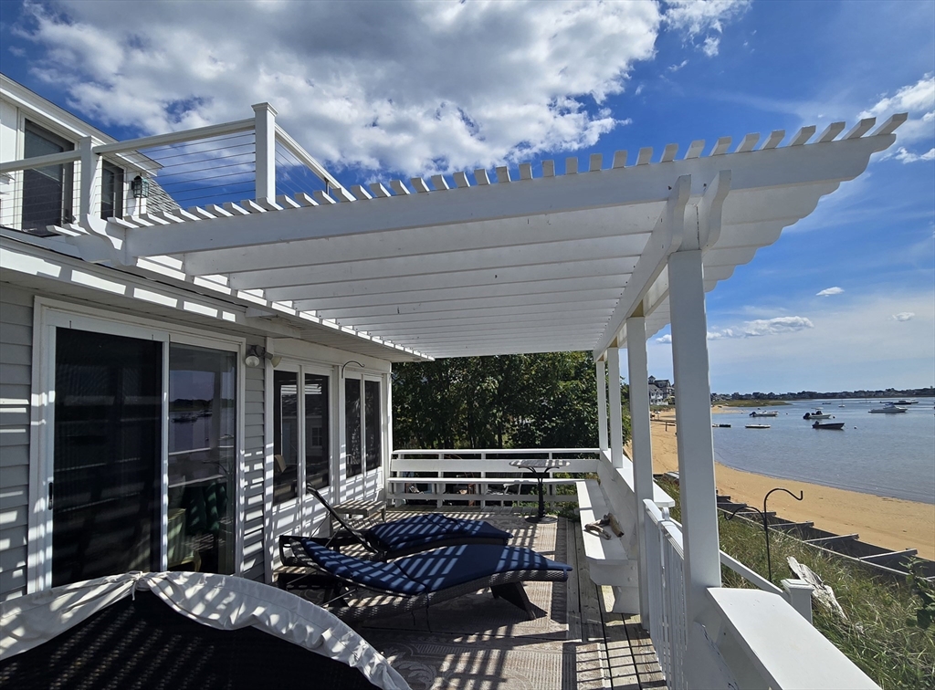 a view of a balcony with two chairs