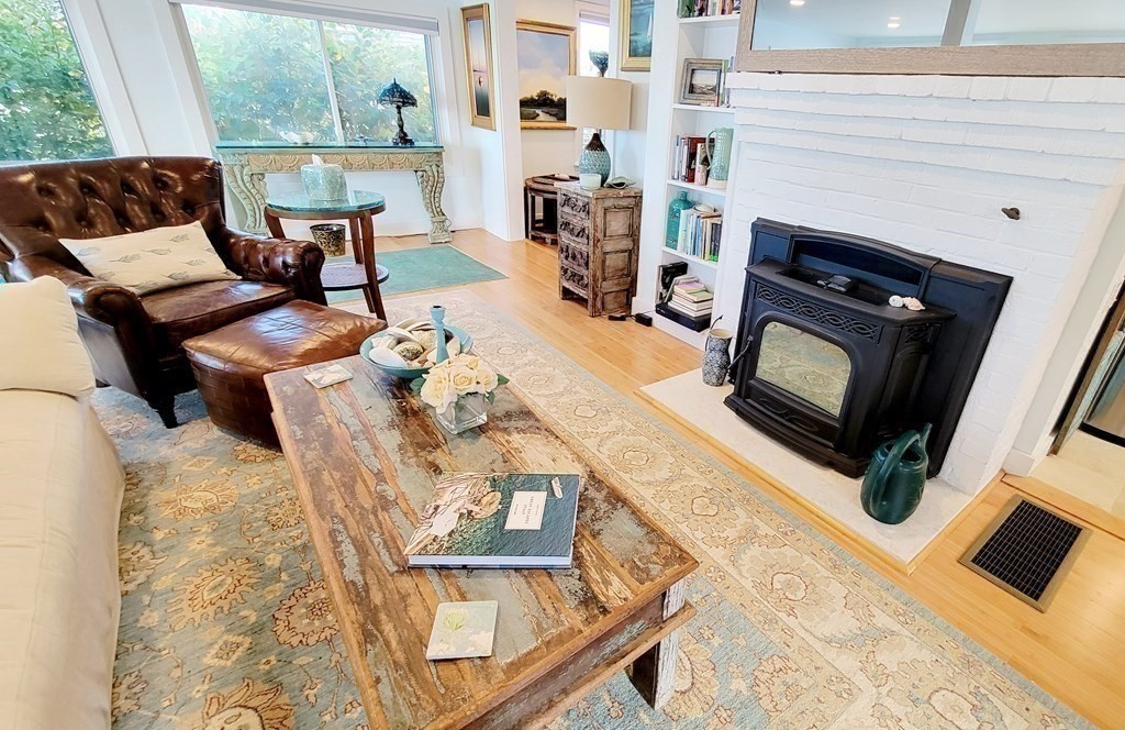 11 Harbor Street Newburyport, MA 01950 - Photo 17 of 39 a living room with furniture and a fireplace