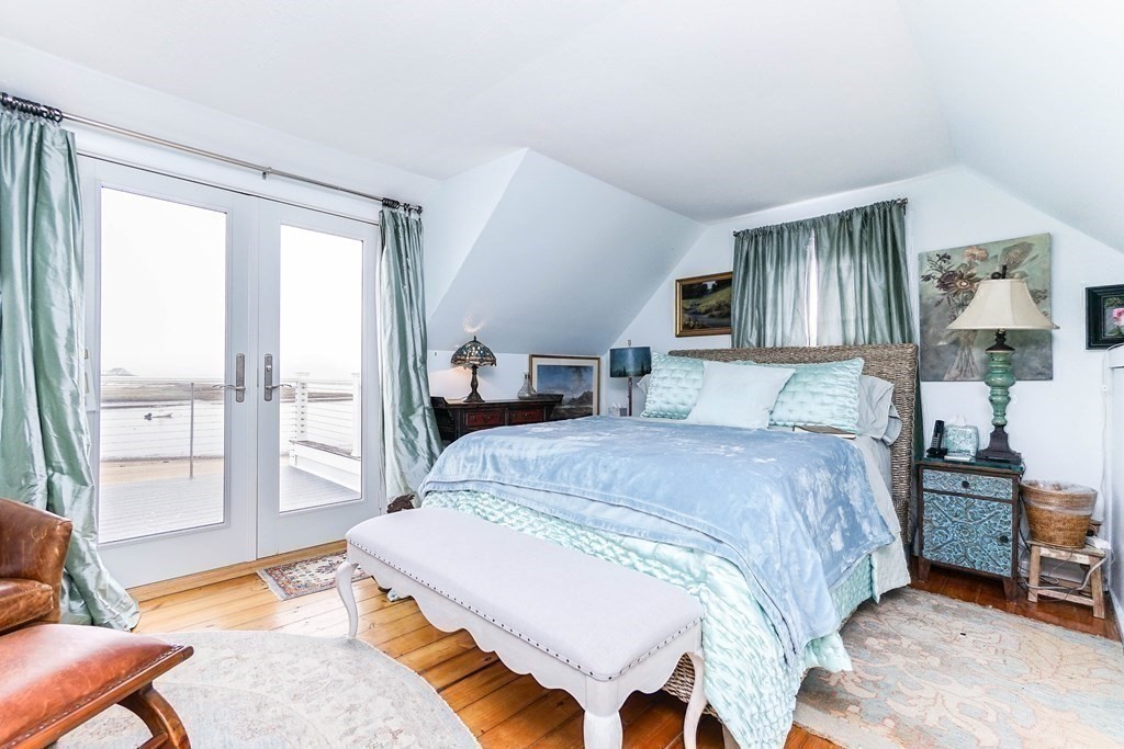 11 Harbor Street Newburyport, MA 01950 - Photo 20 of 39 a bedroom with a bed and wooden floor