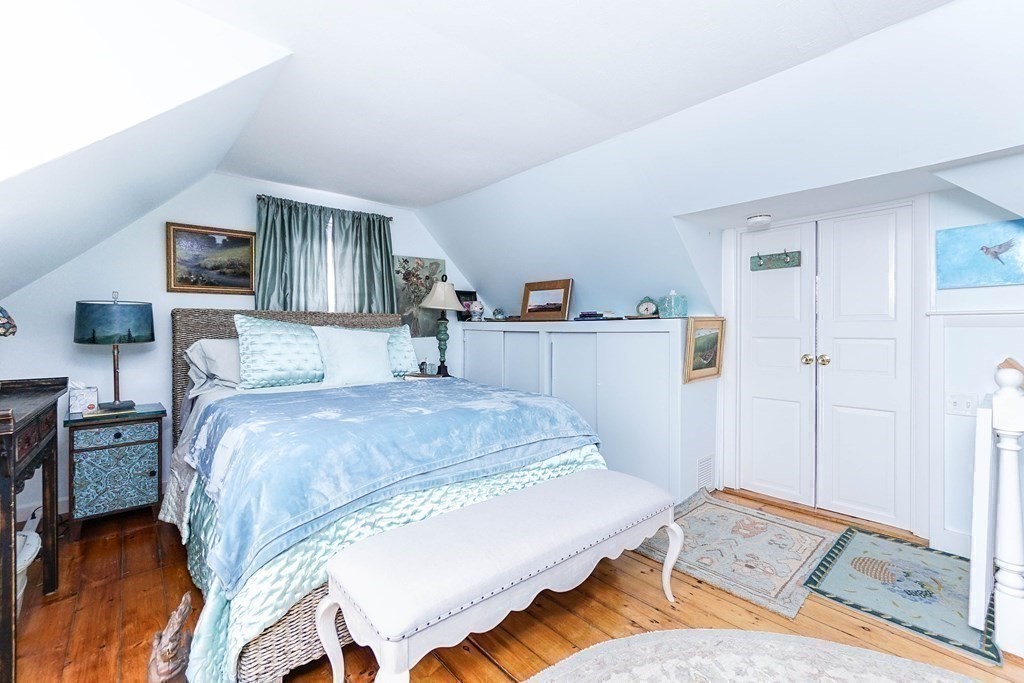 11 Harbor Street Newburyport, MA 01950 - Photo 22 of 39 a bedroom with a bed and a view of kitchen