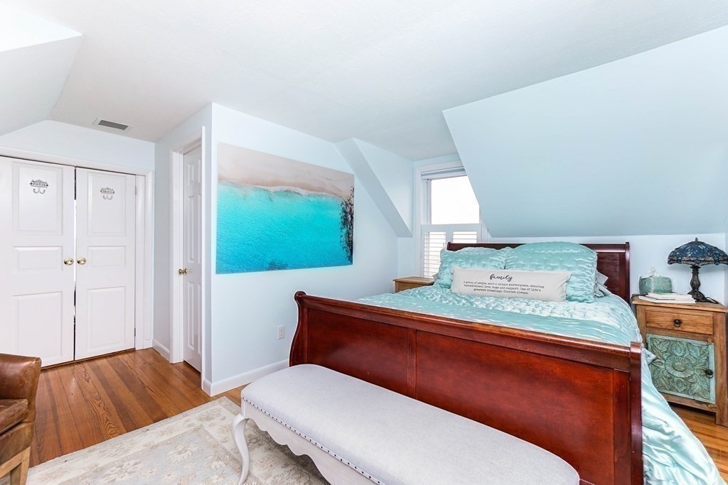 11 Harbor Street Newburyport, MA 01950 - Photo 25 of 39 a bedroom with a bed and dresser