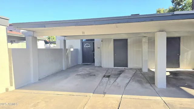 a view of a big room with wooden floor and windows