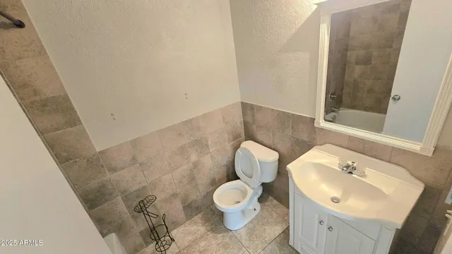 a view of a room with wooden floor and door