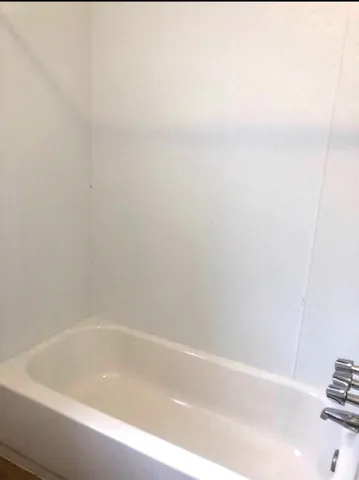 a close up of a bathtub in a bathroom