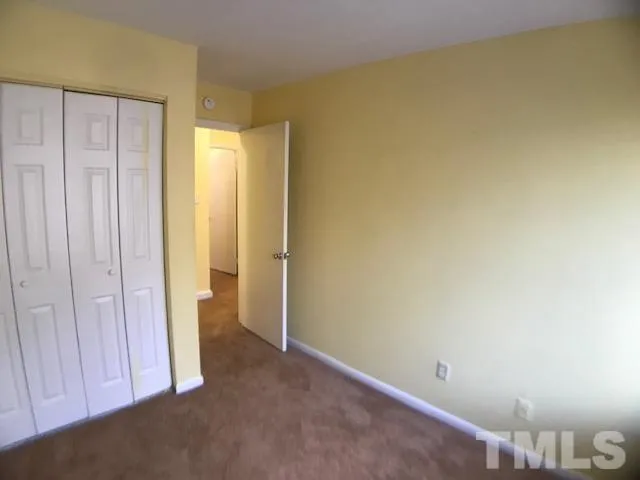 a view of a room with a wooden wall