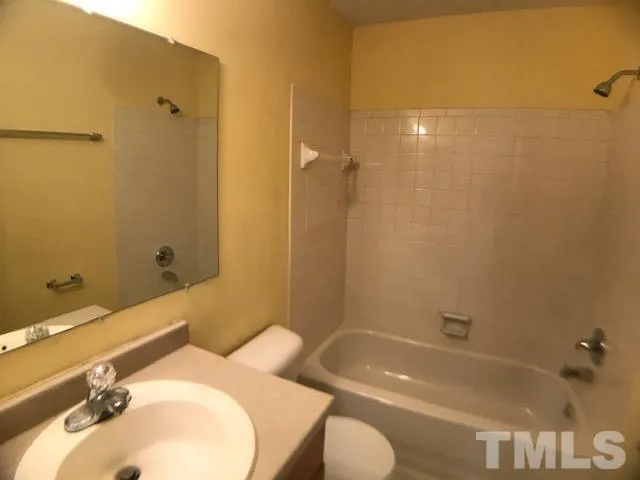 a bathroom with a sink and toilet