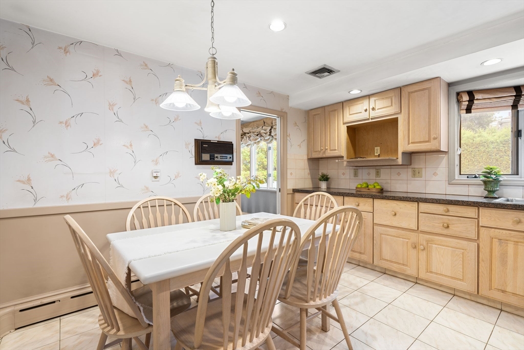 50 Tomahawk Road Arlington, MA 02474 - Photo 16 of 41 a view of a dining room with furniture