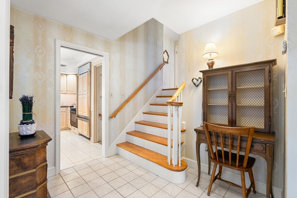 50 Tomahawk Road Arlington, MA 02474 - Photo 6 of 41 a view of entryway and hall with wooden floor