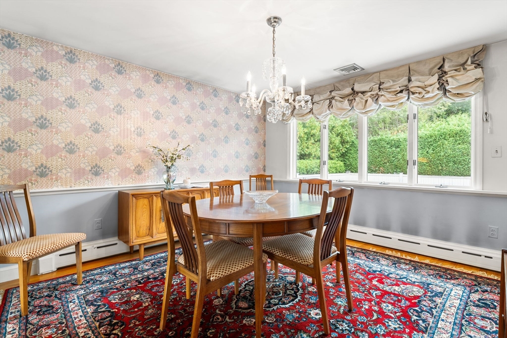 50 Tomahawk Road Arlington, MA 02474 - Photo 8 of 41 a view of a dining table and chairs in the patio