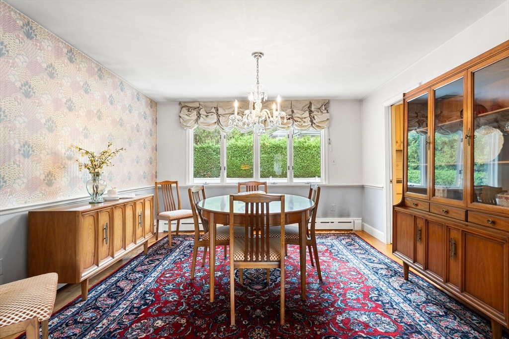 50 Tomahawk Road Arlington, MA 02474 - Photo 9 of 41 a view of a dining room with furniture window and wooden floor