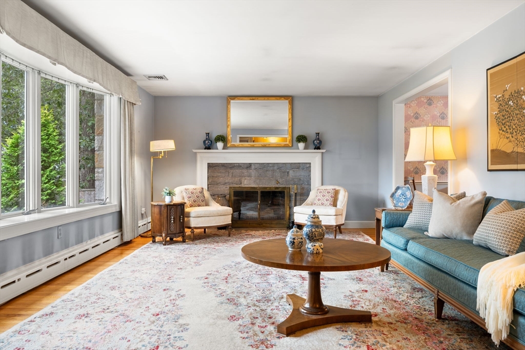 50 Tomahawk Road Arlington, MA 02474 - Photo 10 of 41 a living room with furniture fireplace and a large window