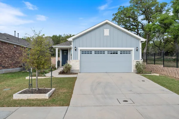 a view of a house with backyard