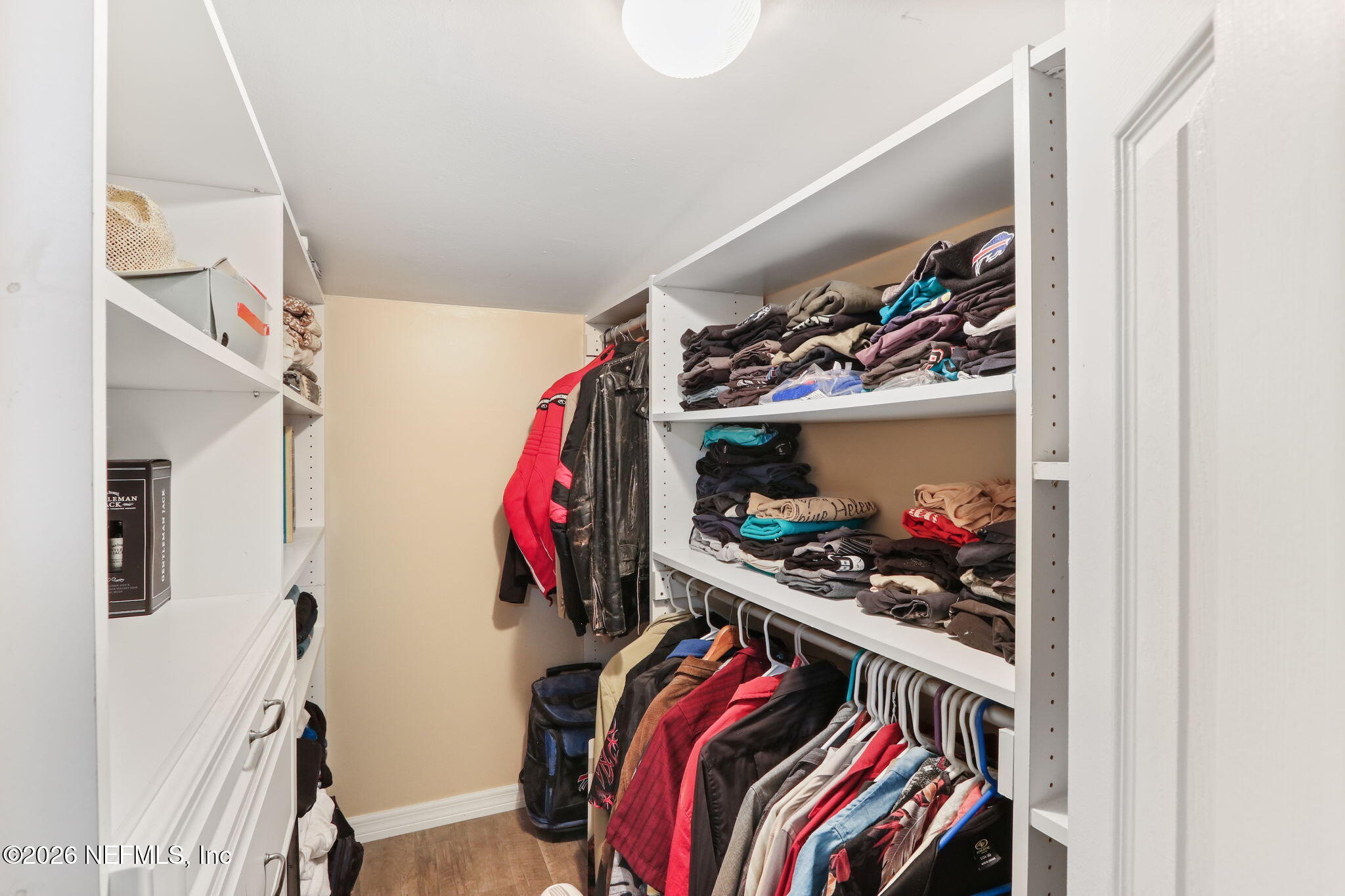 85930 North Harts Road Yulee, FL 32097 - Photo 17 of 50 a view of walk in closet with clothes