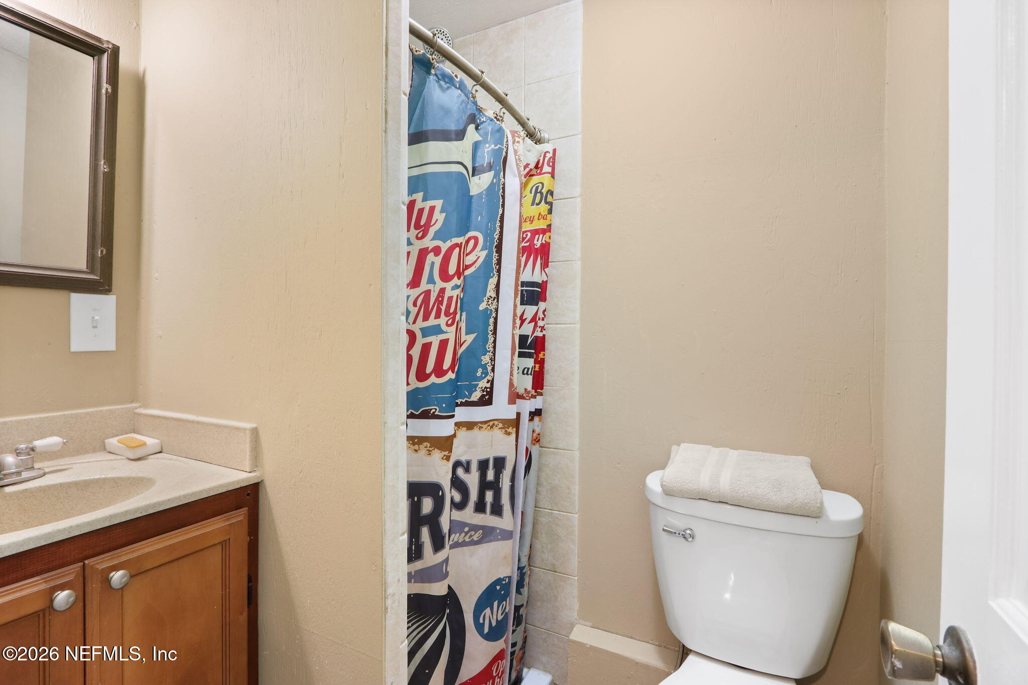 85930 North Harts Road Yulee, FL 32097 - Photo 26 of 50 a bathroom with a toilet and a sink