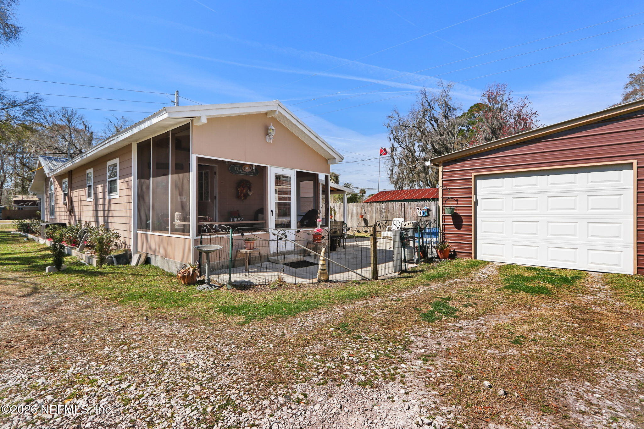 85930 North Harts Road Yulee, FL 32097 - Photo 41 of 50 a view of a house with backyard porch and sitting area