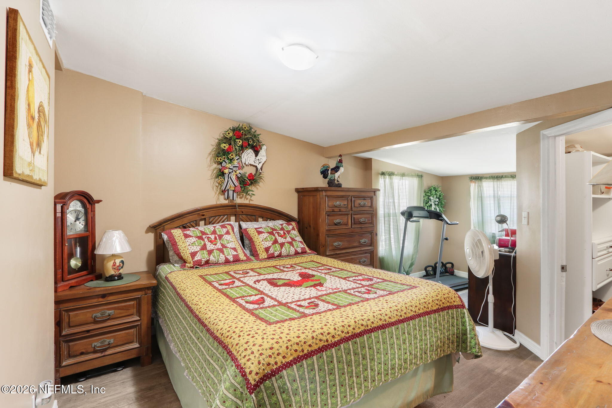 85930 North Harts Road Yulee, FL 32097 - Photo 6 of 50 a bedroom with a bed and a dresser in it