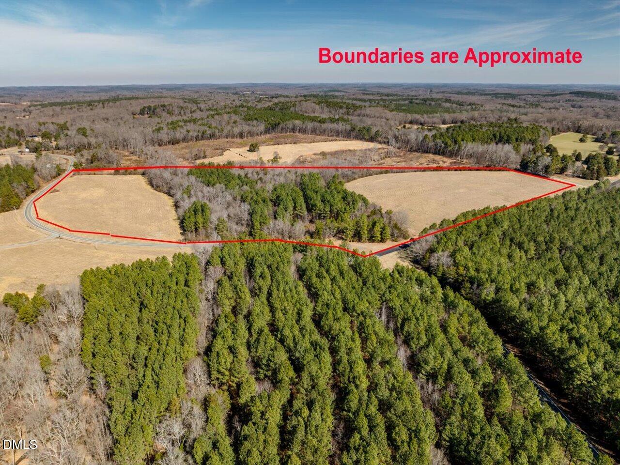 0 Mark Willett Road Bear Creek, NC 27207 - Photo 1 of 28 a view of a street with a building in the background