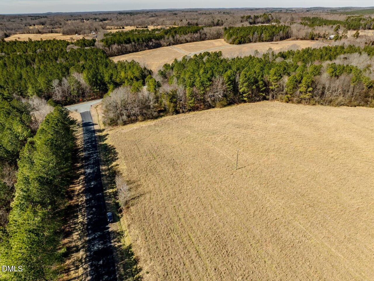 0 Mark Willett Road Bear Creek, NC 27207 - Photo 23 of 28 an aerial view of lake and residential houses with outdoor space