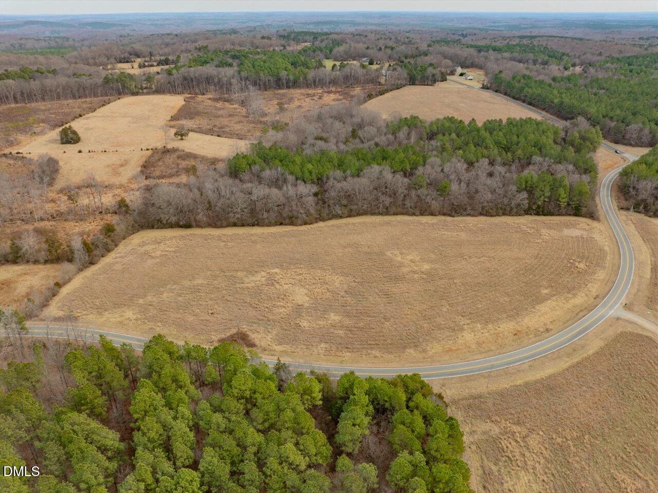 0 Mark Willett Road Bear Creek, NC 27207 - Photo 4 of 28 an aerial view of a house with a yard and lake view