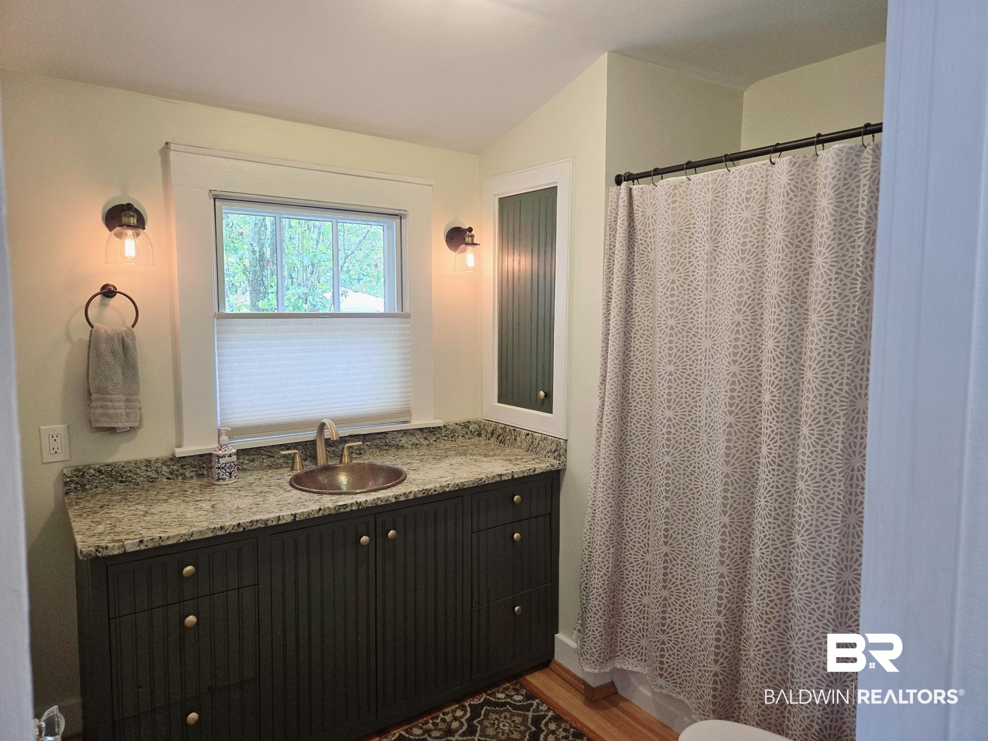 54 South Catherine Street Mobile, AL 36604 - Photo 28 of 55 Bathroom featuring wood finished floors, vanity, a shower with curtain, and vaulted ceiling